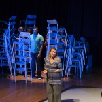 Production shot of Cracked with stacked up chairs in the background