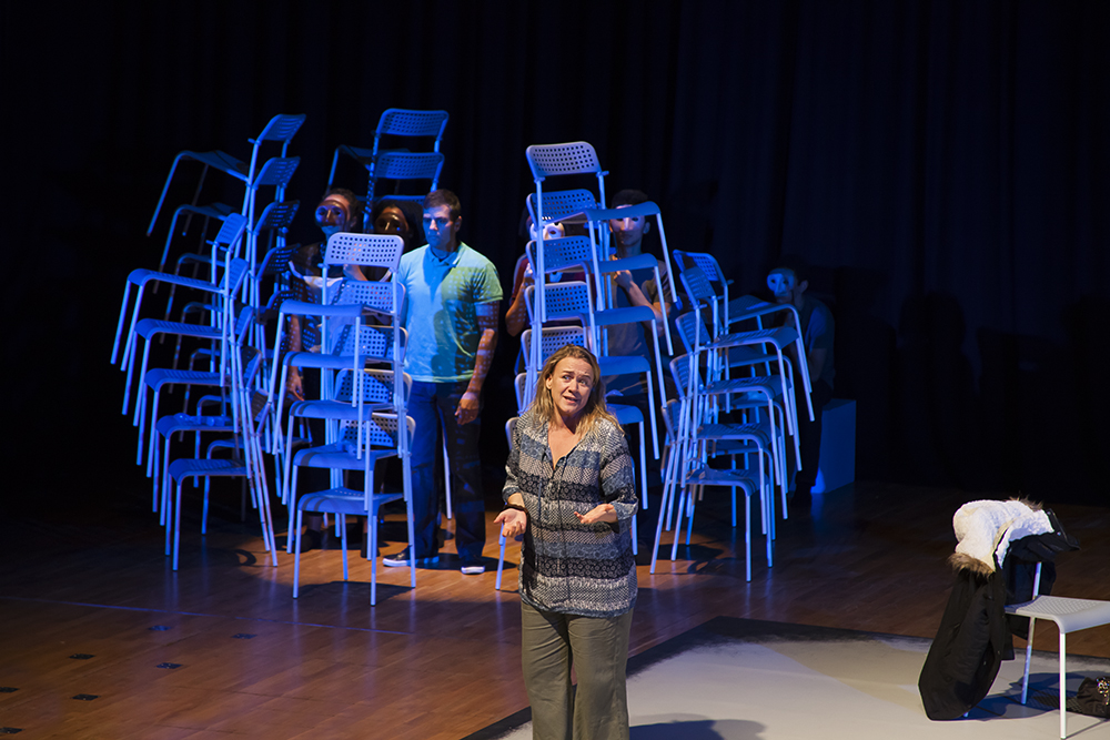 Production shot of Cracked with stacked up chairs in the background
